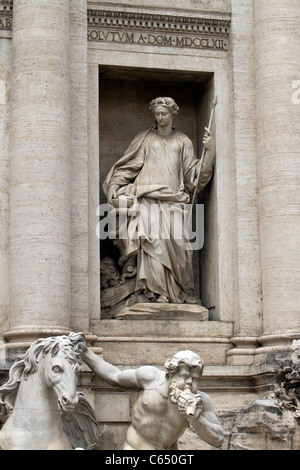 Trevi Fountain figure in historic Rome Italy. Largest Baroque fountain in the city and one of the most famous fountains. Stock Photo