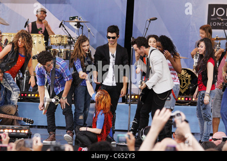 Nick Jonas, Joe Jonas, Kevin Jonas, (The Jonas Brothers) on stage for Good Morning America GMA Concert Series with The Jonas Brothers, Rumsey Playfield in Central Park, New York, NY August 13, 2010. Photo By: Rob Kim/Everett Collection Stock Photo