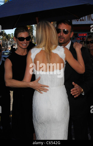 Faith Hill, Gwyneth Paltrow, Tim McGraw at the induction ceremony for Star on the Hollywood Walk of Fame Ceremony for Gwyneth Paltrow, Hollywood Boulevard, Los Angeles, CA December 13, 2010. Photo By: Michael Germana/Everett Collection Stock Photo