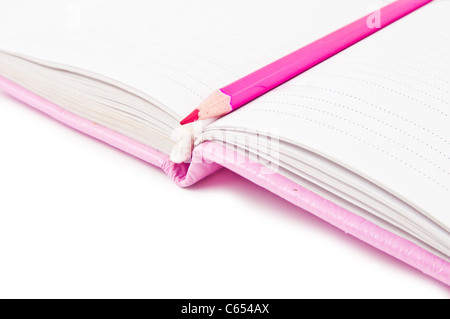 Pink notebook and pencil Stock Photo