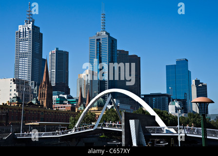 Bridge Over Yarra River Showing Collins Street Skyscrapers and Tower Buildings from Southbank Promenade Melbourne Australia Stock Photo