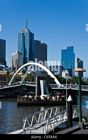 Bridge Over Yarra River Showing Collins Street Skyscrapers and Tower Buildings from Southbank Promenade Melbourne Australia Stock Photo