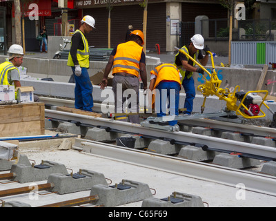 Paris, France, Workers at Construction Site, Group of African Immigrants Working on T3 Tramway on Street, immigrants Europe, labourer france Stock Photo