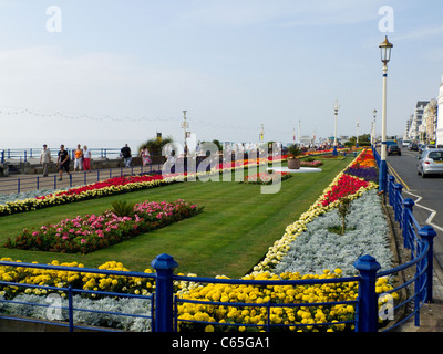 Eastbourne Grand Parade with flower beds in full bloom. Manicured lawns and colourful blooms Stock Photo