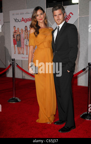 Dave Annable, Odette Yustman (wearing a J. Mendel gown) at arrivals for YOU AGAIN Premiere, El Capitan Theatre, Los Angeles, CA Stock Photo