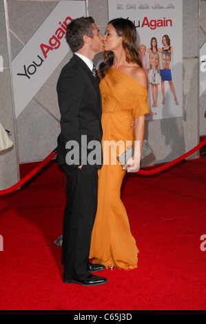 Dave Annable, Odette Yustman (wearing a J. Mendel gown) at arrivals for YOU AGAIN Premiere, El Capitan Theatre, Los Angeles, CA Stock Photo