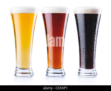 Three pints of beer, of three different colors, isolated on a white background. Stock Photo