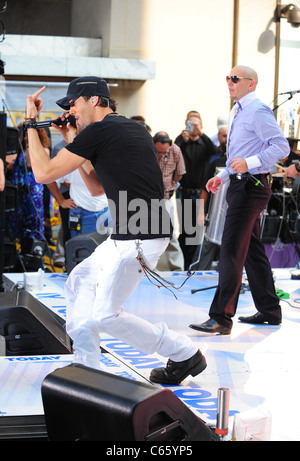 Enrique Iglesias, Pitbull on stage for NBC Today Show Concert with Enrique Iglesias, Rockefeller Plaza, New York, NY July 16, 2010. Photo By: Gregorio T. Binuya/Everett Collection Stock Photo