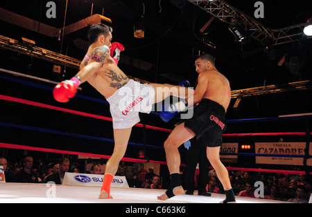 Marc Deluca (white trunks), Omar Ahmed (black trunks) at a public appearance for TAKE ON SHOW Presents $10,000 Professional Muay Thai Kickboxing Tournament, 7 Train Theater, Flushing, NY July 17, 2010. Photo By: Gregorio T. Binuya/Everett Collection Stock Photo