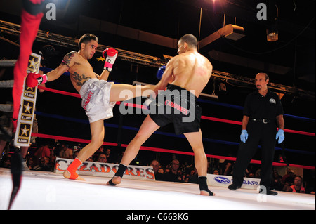 Marc Deluca (white trunks), Omar Ahmed (black trunks) at a public appearance for TAKE ON SHOW Presents $10,000 Professional Muay Thai Kickboxing Tournament, 7 Train Theater, Flushing, NY July 17, 2010. Photo By: Gregorio T. Binuya/Everett Collection Stock Photo