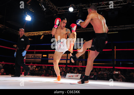 Marc Deluca (white trunks), Omar Ahmed (black trunks) at a public appearance for TAKE ON SHOW Presents $10,000 Professional Muay Thai Kickboxing Tournament, 7 Train Theater, Flushing, NY July 17, 2010. Photo By: Gregorio T. Binuya/Everett Collection Stock Photo