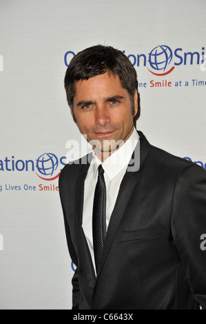 John Stamos at arrivals for Operation Smile's 9th Annual Smile Gala, Beverly Hilton Hotel, Beverly Hills, CA September 24, 2010. Photo By: Robert Kenney/Everett Collection Stock Photo