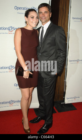 John Stamos, Wife at arrivals for Operation Smile's 9th Annual Smile Gala, Beverly Hilton Hotel, Beverly Hills, CA September 24, 2010. Photo By: Dee Cercone/Everett Collection Stock Photo