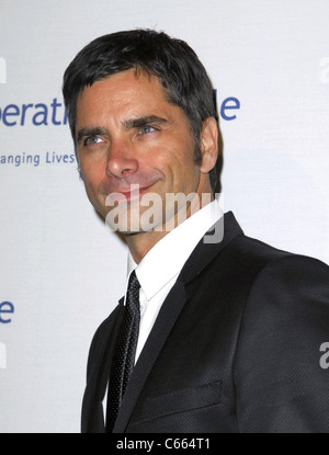 John Stamos at arrivals for Operation Smile's 9th Annual Smile Gala, Beverly Hilton Hotel, Beverly Hills, CA September 24, 2010. Photo By: Elizabeth Goodenough/Everett Collection Stock Photo