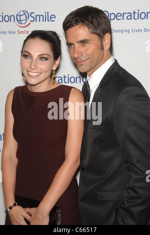 John Stamos (right) at arrivals for Operation Smile's 9th Annual Smile Gala, Beverly Hilton Hotel, Beverly Hills, CA September 24, 2010. Photo By: Michael Germana/Everett Collection Stock Photo