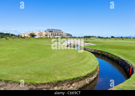 The Swilcan Bridge over the Swilcan Burn with the Old Course Hotel behind, Old Course at St Andrews, Fife, Scotland, UK Stock Photo