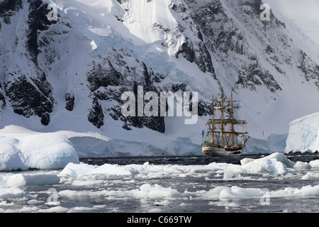 GRAHAM LAND, ANTARCTIC PENINSULA - FEBRUARY 14, 2011: Three-masted Dutch tall ship 'bark Europa' anchored in Orne Harbour. Stock Photo