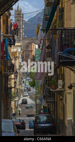 Traditional street with colored house and church in Palermo, Sicily (Italian medieval and baroque architecture),Italy, Europe Stock Photo