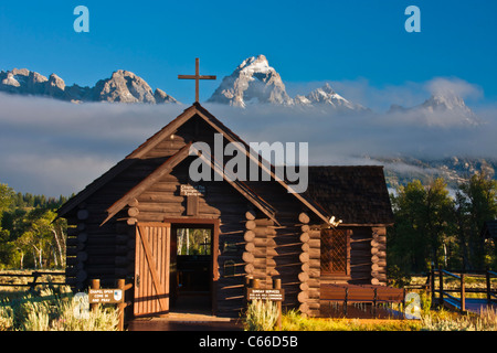 Grand Tetons Mountain Range and the Episcopal Chapel of the Transfiguration at sunrise in Grand Tetons National Park in Wyoming. Stock Photo