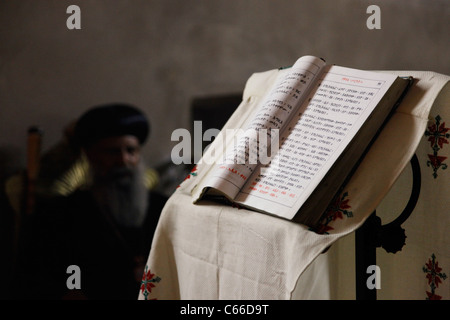 The Bible in Amharic language is seen inside the upper section of the Ethiopian church beneath Deir El-Sultan monastery which is located on the roof of the Church of Holy Sepulchre in old city of East Jerusalem Israel Stock Photo