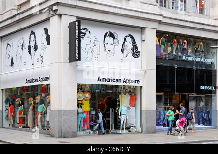 London street scene shop front of American Apparel retail clothing store business on corner shopping location Kensington High Street England UK Stock Photo