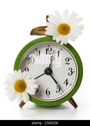 Retro alarm clock and daisy flowers. Good morning, wake up, time ...