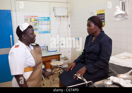 A nurse consults with a patient at Mbale Regional Referral Hospital in Mbale, eastern Uganda. Stock Photo