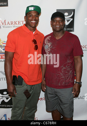 Cam Newton, Warren Moon in attendance for Sports Dream Bowl Benefit for Urban Youth Scholarship Fund, Texas Station, North Las Vegas, NV June 25, 2011. Photo By: James Atoa/Everett Collection Stock Photo
