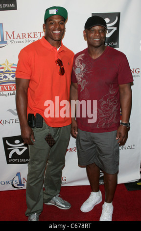 Cam Newton, Warren Moon in attendance for Sports Dream Bowl Benefit for Urban Youth Scholarship Fund, Texas Station, North Las Vegas, NV June 25, 2011. Photo By: James Atoa/Everett Collection Stock Photo