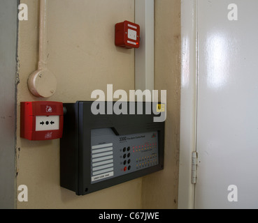 Labelled Conventional Communal EN54 Fire Alarm Control Panel with a code being entered Stock Photo