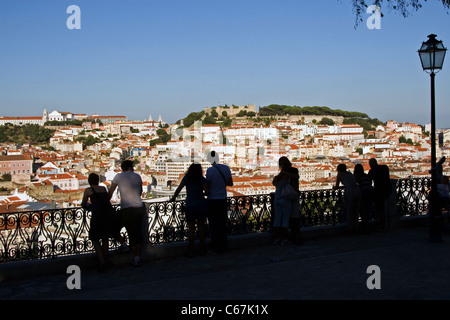 Evening.Looking from Miradouro de São Pedro de Alcântara, Bairro Alto, towards Alfama + Baixa districts + castle,Lisbon,Portugal Stock Photo