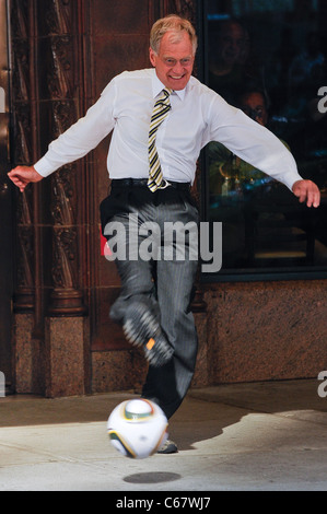 Professional soccer player Landon Donovan, David Letterman, perform skit in front of the Ed Sullivan Theater out and about for CELEBRITY CANDIDS - TUESDAY, , New York, NY June 29, 2010. Photo By: Ray Tamarra/Everett Collection Stock Photo