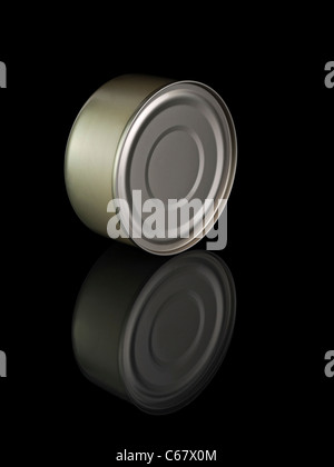 A golden tuna fish tin can and its reflection, isolated on black. Stock Photo