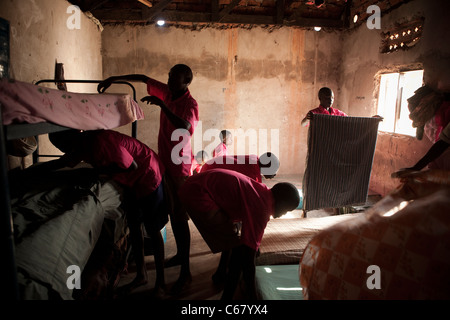 School boys straighten their dormitories at a boarding school in Amuria, Uganda, East Africa. Stock Photo
