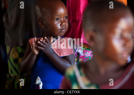 A young child attends a church service in Amuria, Uganda, East Africa. Stock Photo