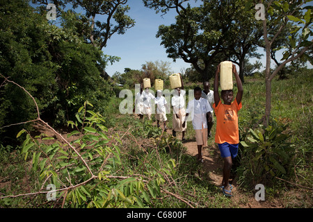 School children fetch water in Amuria, Uganda, East Africa. Stock Photo