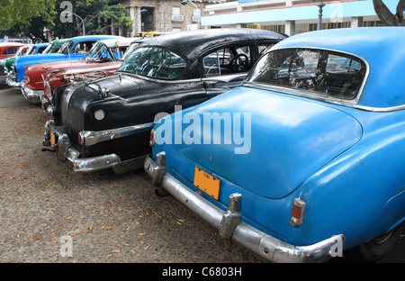 Colourful vintage taxis parked in a street in Havana, Cuba. Stock Photo