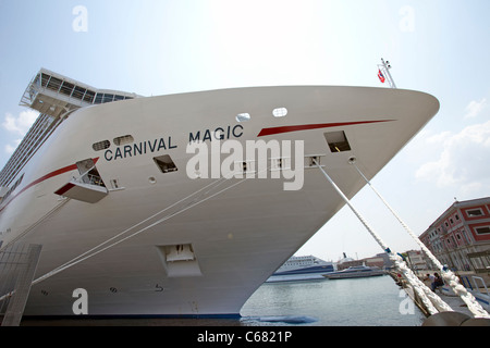 Carnival Magic new cruise ship in port Venice Italy. Close front view of tie ropes to dock. Stock Photo