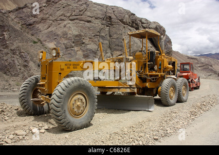 road grader parked in the Himalayas on the hazardous road to Kashmir northern India Stock Photo