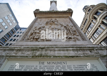 The Monument, erected near Pudding Lane where the Great fire of London in 1666 began, which is now a London tourism attraction Stock Photo