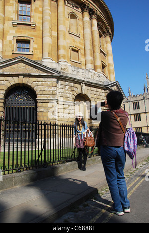 posing in front of Radcliffe Camera Oxford United Kingdom Stock Photo