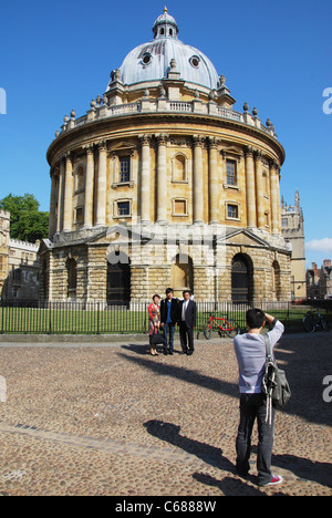 posing in front of Radcliffe Camera Oxford United Kingdom Stock Photo