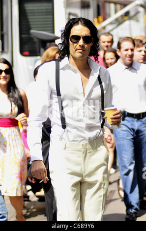 Russell Brand walks to the 'Arthur' movie set on 3rd ave. in New York City. out and about for CELEBRITY CANDIDS - FRIDAY, , New Stock Photo