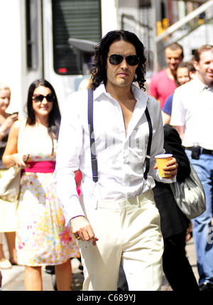 Russell Brand walks to the 'Arthur' movie set on 3rd ave. in New York City. out and about for CELEBRITY CANDIDS - FRIDAY, , New Stock Photo