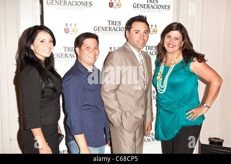 Oscar de lay Hoya (2nd from right) at arrivals for Oscar de lay Hoya Tres Generaciones Tequila Cinco de May Kickoff Party, The Ebell Club of Los Angeles, Los Angeles, CA May 4, 2011. Photo By: Emiley Schweich/Everett Collection Stock Photo