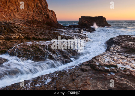 Dramatic view of a sea stack in Davenport Beach, Santa Cruz. Stock Photo