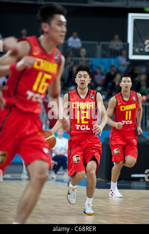 Yu Shulong (12) and Yi Jianlian (11), China v France, International Basketball; part of the London Prepares series for the 2012 Olympics. Stock Photo