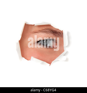 Female person looking through torn hole in white wall. All on white background. Stock Photo