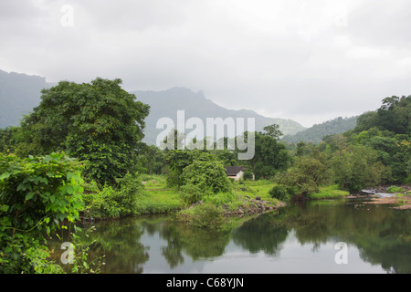 Monsoon Riverscape with Mahuli fort in the backdrop. At Mahuli, Dist. Thane, Maharashtra. Stock Photo