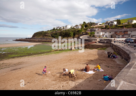 The beach and harbour wall at Portmellon, Cornwall, SW UK Stock Photo